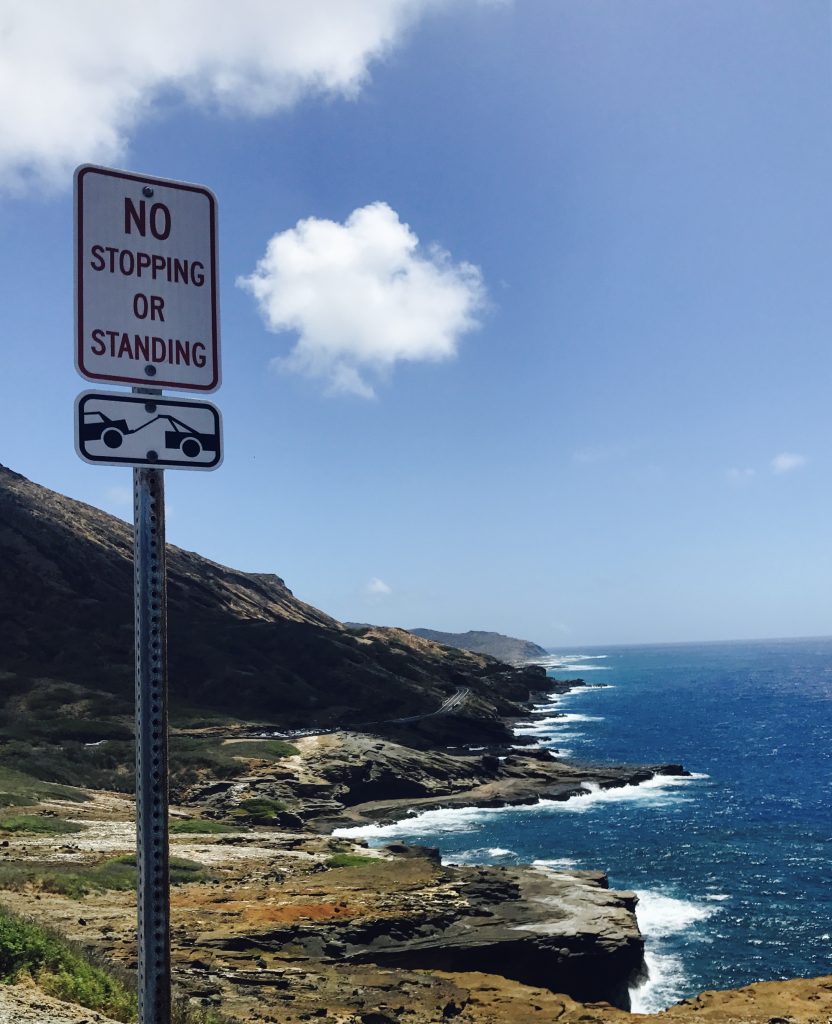 hawaii blues no standing sign by the cliff